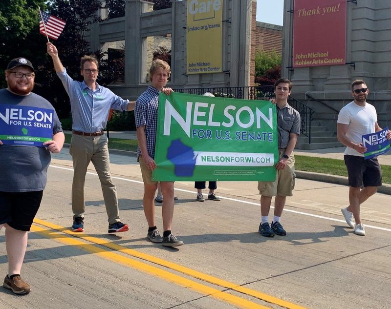 Tom and interns marching in Sheboygan 4th of July Parade.